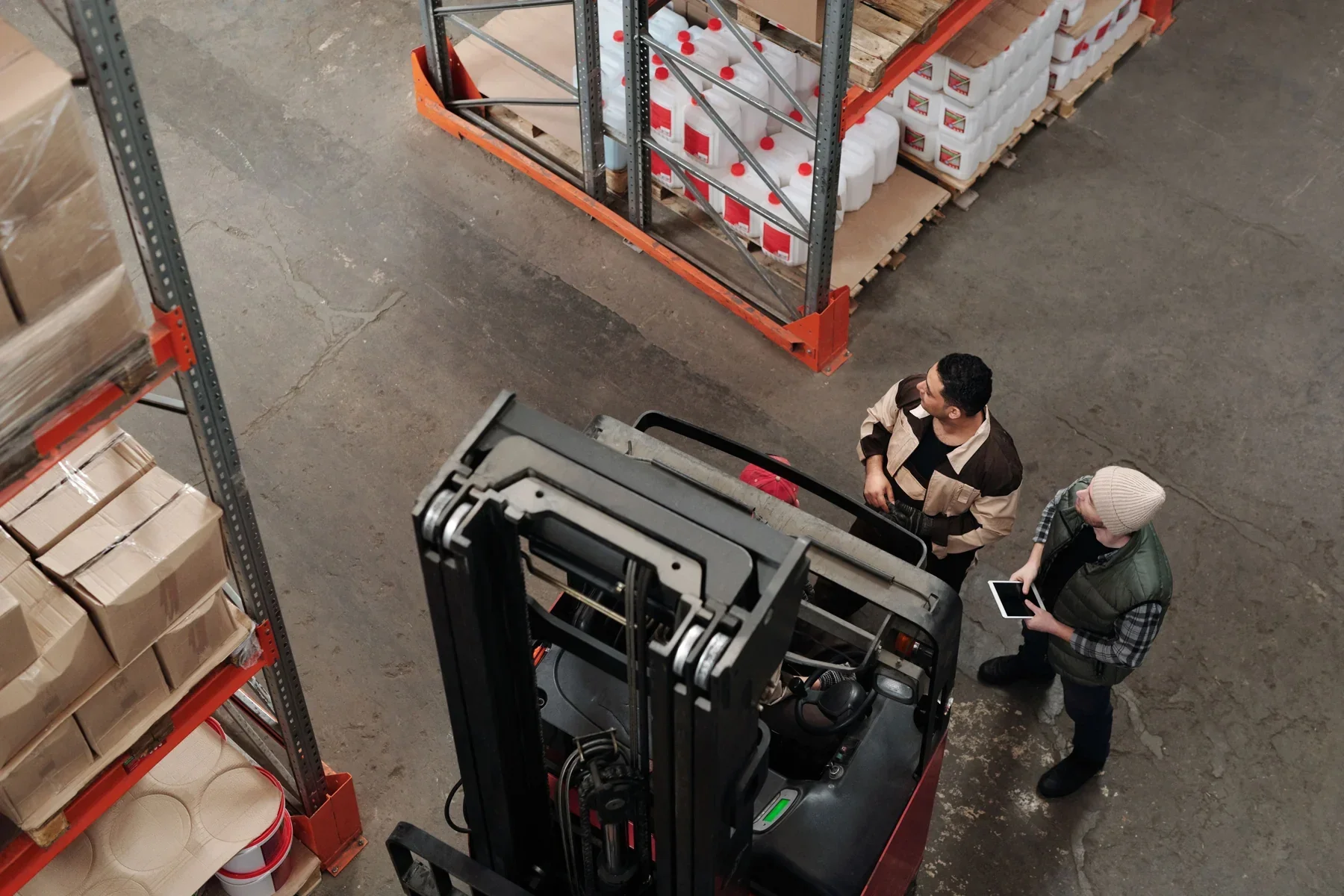 Team checking sourced goods in a warehouse